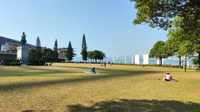 People relaxing at Sun Yat Sen Memorial Park, a waterfront park in the Sai Ying Pun area of Hong Kong Island, facing Victoria Harbour. The park is named after Sun Yat Sen.